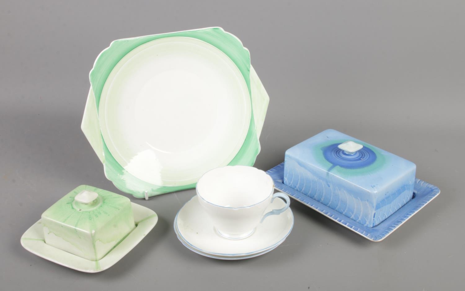 A small collection of Shelley pottery and china. Includes two butter dishes, cup and two saucers and