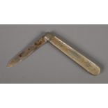 An Edwardian silver bladed fruit knife with carved mother of pearl handle. Assayed Sheffield 1901 by