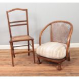 Two chairs including one begere backed example and one featuring bergere base.