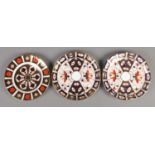 Three Royal Crown Derby Plates in the Imari colours.
