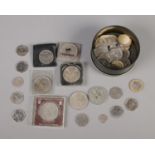 A collection of British coins including commemorative crowns, alphabet 10p, 50p's and two silver