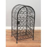An iron wine rack with hinged door. Space for 26 bottles.