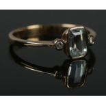 A 9ct Gold, Aquamarine and Diamond ring. Size MÂ½. Total weight: 1.5g.