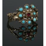 An antique turquoise, pearl and garnet ring. Size MÂ½. Total weight: 1.8g. Unmarked, tests to 9ct