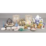 A box of miscellaneous. Includes art glass, Mdina paperweight, oil lamp shades, novelty teapots etc.