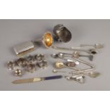 A collection of silver plated items including napkin rings, cutlery, brush, wine funnel, etc.