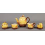 A Burleigh ware five piece oak and acorn part tea set. Includes teapot, cream jug and condiment set.