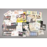 A tray of assorted mint and used stamps and albums. Includes Â£10 stamp, empty World Cup 90 stamp