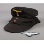 A German Third Reich M43 style cap along with embroidered patch.