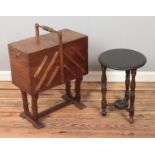 A cantilever sewing box along with small occasional table raised on turned supports.