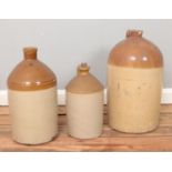 Three stoneware flagons, including Pearsons of Chesterfield and W Foster of Coventry. Largest