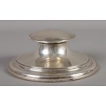 A silver filled capstan inkwell, assayed for London, 1924, by Charles & Richard Comyns. Total