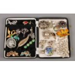 A collection of twenty-four vintage costume jewellery brooches.
