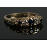 An 18ct Gold Sapphire and Diamond five stone diamond ring. Size N. Total weight: 4.4g.