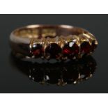 A 9ct Rose Gold and Garnet ring, assayed for Chester. Size N. Total weight: 2.3g.