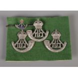 Three Durham Light Infantry cap badges along with bar brooch, all stamped Sterling to reverse. Total