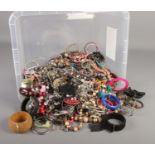 A box of modern costume jewellery. Includes beads, bangle, rings etc.