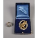 A German WWII Third Reich Fallshirmjaeger Luftwaffe Paratrooper badge and ring (possibly silver). No