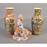 A pair of Oriental vases along with a ceramic seal with Imari decoration.