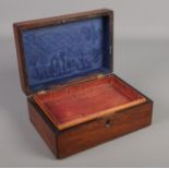 A Victorian rosewood box with mother of pearl inlay.