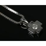 A 9ct White Gold diamond solitaire cross pendant, on box chain. Total weight: 4.5g