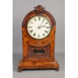 A large 19th century burr walnut mantle clock featuring roman numeral face. Crack to wood under