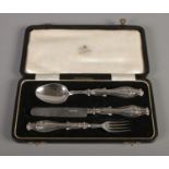 A Victorian three piece silver Christening set, in case. Assayed for Birmingham, 1856 & 1857, by