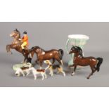 A collection of ceramics to include Beswick rearing jockey, Slyvac jug, Beswick dogs, etc. Tail