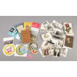 A collection of mixed ephemera. Includes postcards, cigarette cards (modern beauties), road maps,