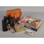 A collection of military themed items. Includes Daily Mail Christmas tin and commemorative shilling,