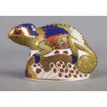 A Royal Crown Derby Chameleon ceramic paperweight, with gold stopper. 9cm high.