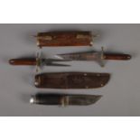 A William Rodgers Sheffield scout knife with sheath along with Indian carving set in decorative