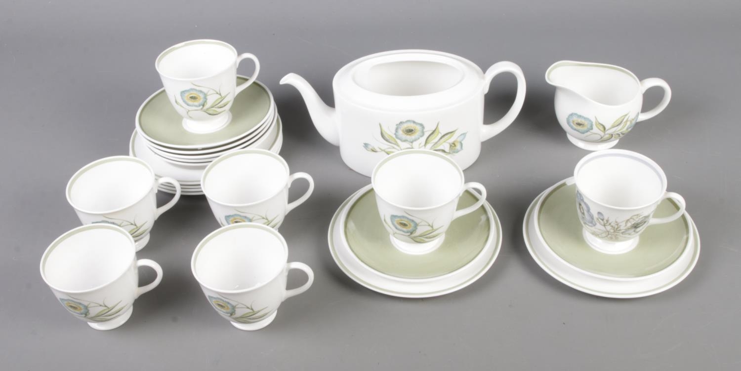 A Susie Cooper Katina pattern tea service to include tea pot, tea cups and saucers. Tea pot lid is