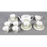 A Susie Cooper Katina pattern tea service to include tea pot, tea cups and saucers. Tea pot lid is