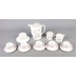 A Susie Cooper Talisman (C1139) pattern tea service to include tea pot, sugar bowl, tea cups and