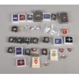 A collection of military Parachute Regiment pins badges.