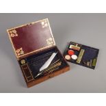 A leather covered stationary box with painted and gilt decoration, fitted interior and contents of