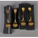 Four Georg Jensen silver gilt year spoons featuring floral enamel decoration. Includes years 1973,
