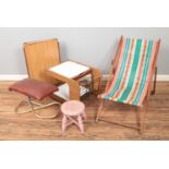 Collection of assorted furniture to include deck chair, footstool and retro table.