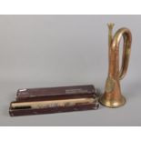 An Argyll and Sutherland Bugle horn along with boxed cleaning kit.