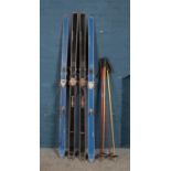 Two pairs of Elan skis and poles.