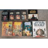 A quantity of Star Wars books and videos. Includes annual No.1 & 2, VHS Phantom Menace & Attack of
