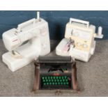 Two Janome sewing machines along with a cased Lilliput type writer. No cables.