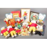 A box of Rupert Bear collectables. Includes Wedgwood ceramics, 1969 Bendy figure, soft toys,