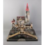 A wooden model of a fort/castle in the style of Moritz Gottschalk featuring sloped entrance and