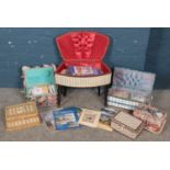 A quantity of sewing baskets with contents of cross stitch kits.