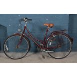 A vintage Raleigh 'Cameo' bike in claret red.