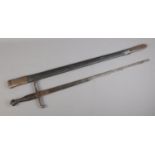 An antique sword featuring crown pommel and stamped twin scrolled cross guard, with scabbard.