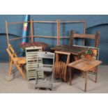 An assortment of wooden garden furniture including clothes horse, tables and chair.
