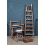 Two sets of vintage ladders, together with two towel rails and a hinged wooden box.